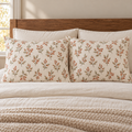 AI-generated concept mockup of two botanical fall pillowcases